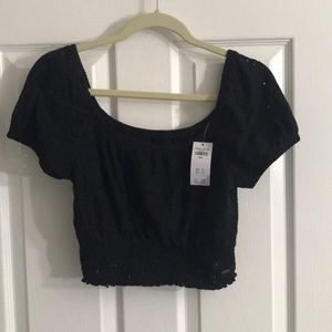 Crop black eyelet off or on shoulder top